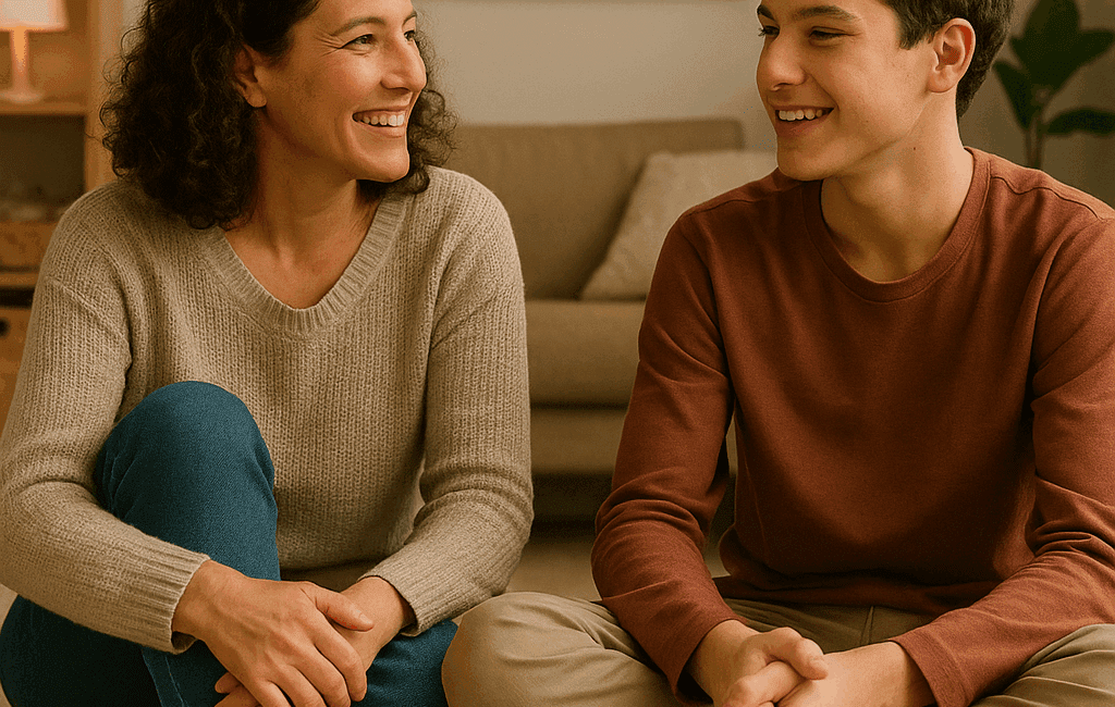 Enmente® Una madre y su hijo adolescente sentados en el suelo de una habitación acogedora, con libros y juegos esparcidos a su alrededor, intercambiando miradas y sonrisas. La imagen está desenfocada suavemente en el fondo para crear un ambiente cálido y familiar. Un cartel en la pared dice "La comunicación es el puente hacia el corazón" en letras claras. Un dato estadístico en la esquina inferior dice "El 75% de los adolescentes valoran la comunicación abierta".